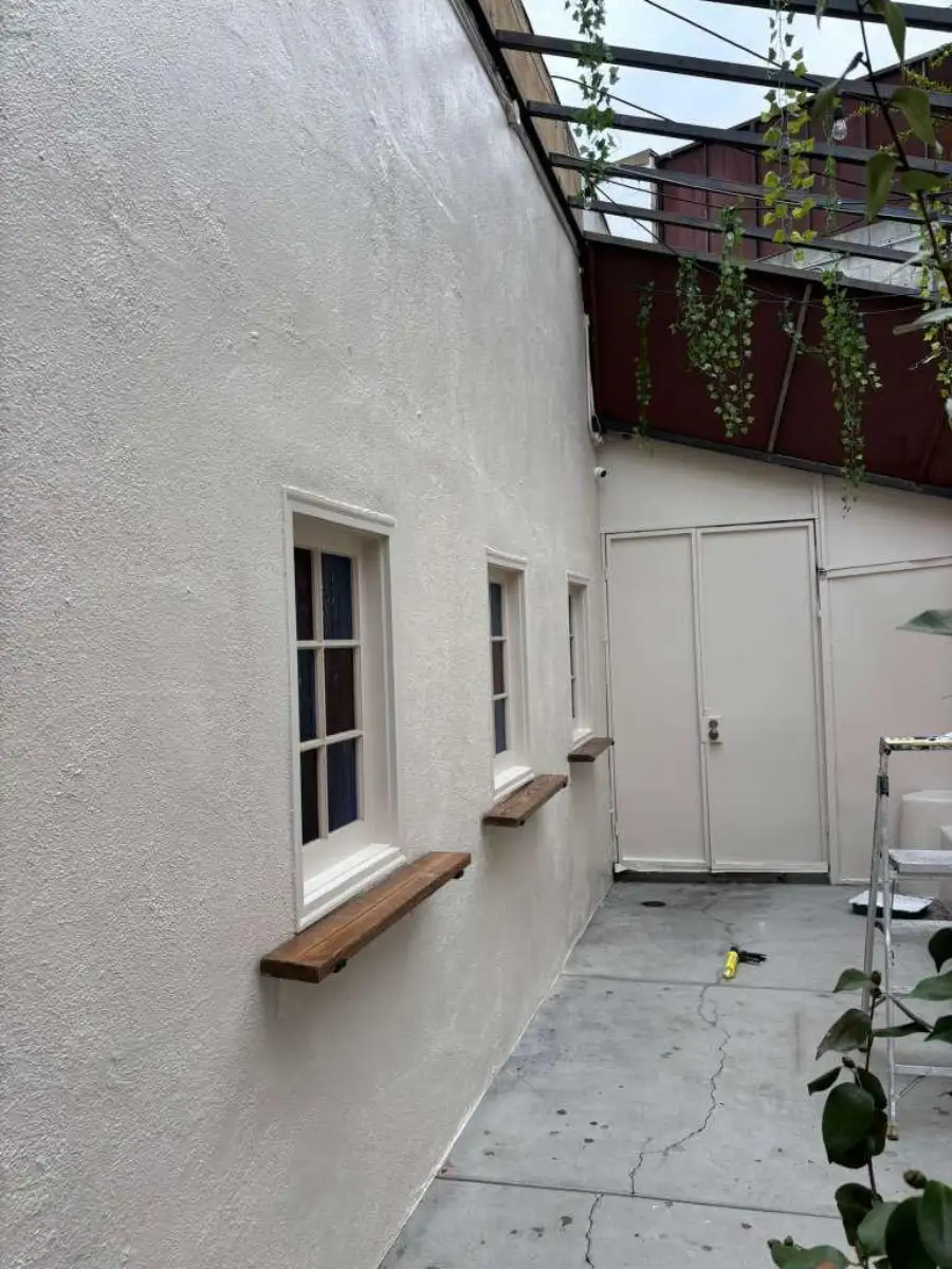 Professional painter applying paint with clean lines